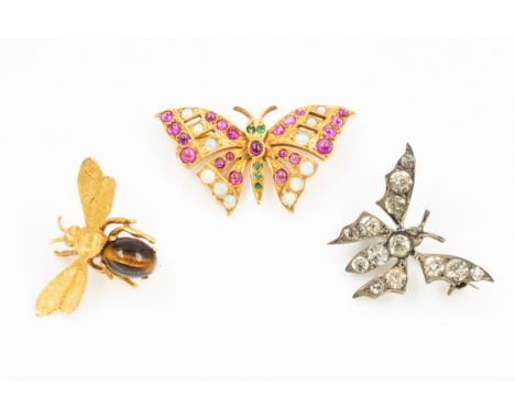 A GROUP OF THREE INSECT BROOCHES (3)Comprising; a gold cabochon ruby, opal and emerald brooch designed as a butterfly, unmark