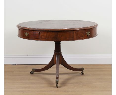 A REGENCY MAHOGANY DRUM TABLEWith four frieze drawers on tripod base, 108cm diameter; 74cm high
