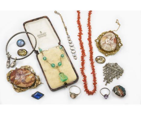 A GROUP OF JEWELLERY (17)Comprising; eleven brooches, two rings, a bangle with two charms, a branch coral necklace, a green p
