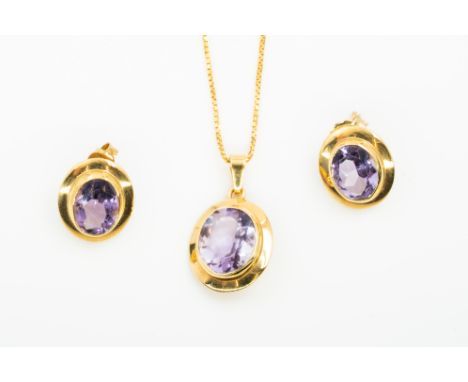 AN AMETHYST NECKLACE AND EARRING SET (2)Comprising; a gold mounted oval cut amethyst single stone pendant, detailed 750, with