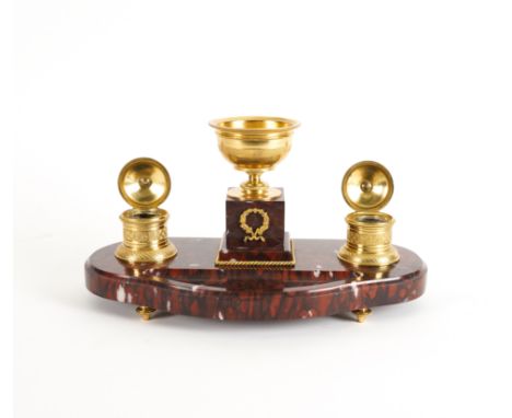 A LOUIS XVI STYLE GILT-METAL MOUNTED ROUGE GRIOTTE MARBLE INKSTANDWith central raised bowl, flanked by two engine milled hing