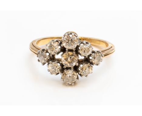 A GOLD AND DIAMOND NINE STONE CLUSTER RINGClaw set with cushion shaped diamonds, unmarked, ring size K and a half, gross weig