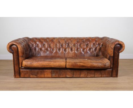 A VICTORIAN STYLE CHESTERFIELD SOFAWith buttonback tan leather upholstery, 235cm wide; 75cm high