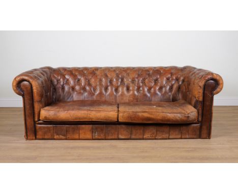 A VICTORIAN STYLE CHESTERFIELD SOFAWith buttonback tan leather upholstery, 235cm wide; 75cm high