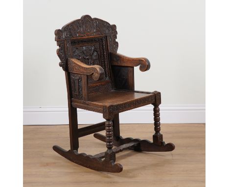 A CARVED OAK ROCKING ARMCHAIR INCORPORATING 17TH CENTURY ELEMENTSWith Adam and Eve carved back panel and bobbin turned suppor