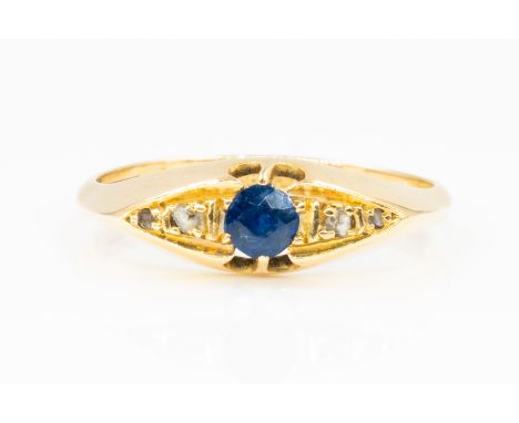 AN 18CT GOLD, SAPPHIRE AND DIAMOND RINGMounted with a central cushion shaped sapphire between rose diamond two stone sides, B