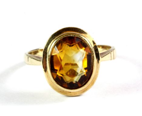 A 9ct yellow gold citrine set ring, (K.5).