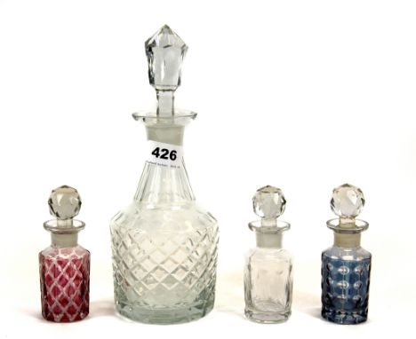 A Victorian decanter and three perfume bottles.
