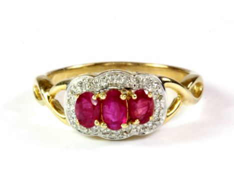A 9ct yellow gold ruby and diamond triple cluster ring, (P.5).