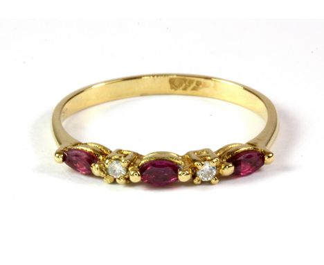 A 9ct yellow gold ruby and diamond set ring, (O).