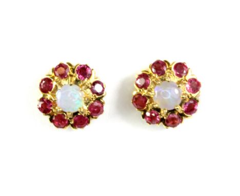 A pair of 9ct yellow gold (stamped 375) opal and rubies cluster earrings.