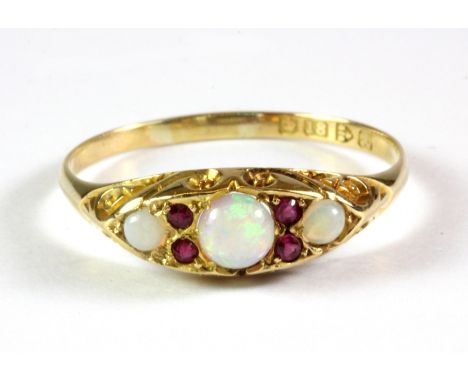 An antique 18ct yellow gold ruby and opal set ring, c. 1900, (T).