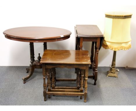 A pedestal table, an oak nest of tables together with an oak tea table and a column table lamp.