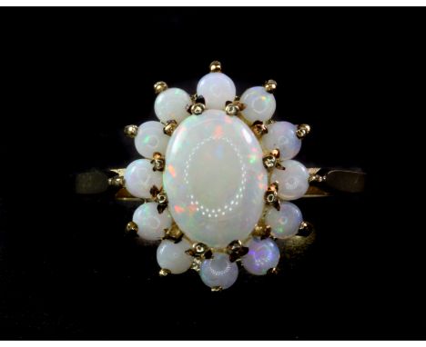 A 9ct yellow gold opal cluster ring, (K).