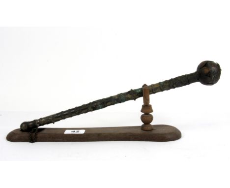 An interesting Eastern wand style item with stand, L. 39cm.