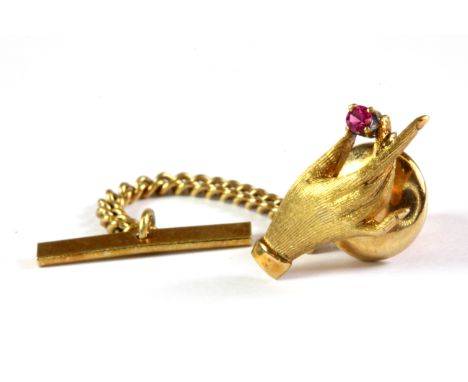 A 14ct yellow gold (stamped 14k) ruby set tie pin.