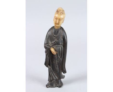 A 19TH CENTURY HARDWOOD (POSSIBLY ZITAN) FIGURE OF GUANYIN with soapstone head and hands.