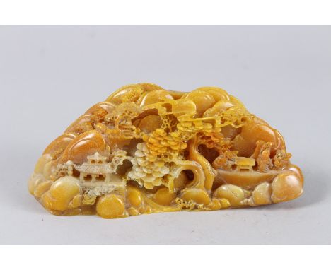 A CHINESE CARVED HARDSTONE BOULDER. 7.25ins high.