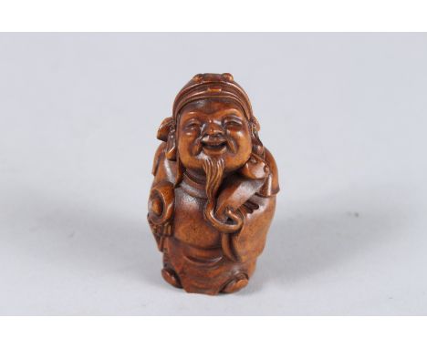 A CARVED WOOD CHINESE MAN NETSUKE. 2.25ins high.