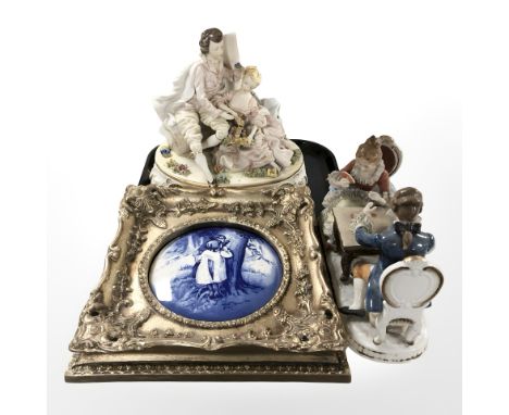 A continental ceramic figural lamp base, a further figure group of a lady and gentleman playing cards (restored) and a blue a