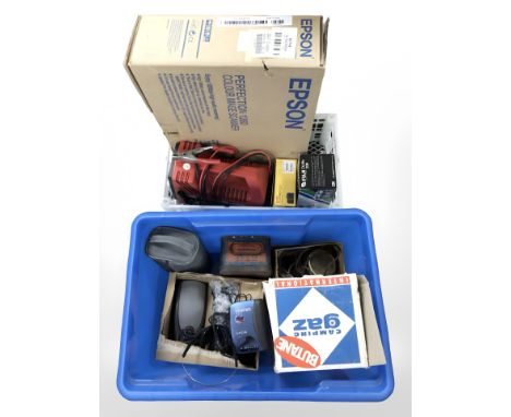 A butane camping stove, Epson scanner in box, Kodak and Fuji digital cameras, car jumpstarter, Sony Walkman, other electrical