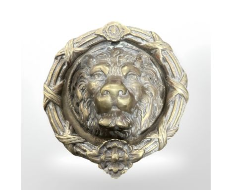 A large cast brass lion mask door knocker, diameter 25 cm