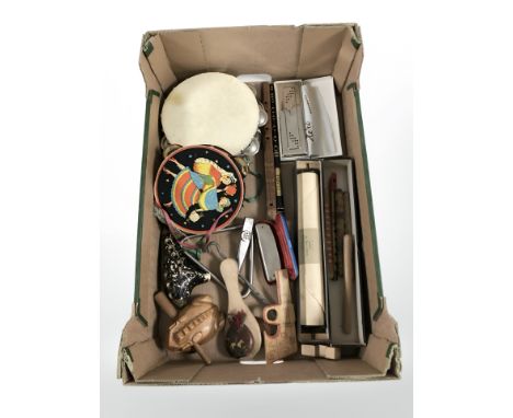 A group of musical instruments including recorders, a Hero harmonica, tambourines, a pianola roll, etc. (1 box)