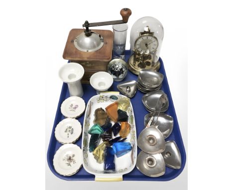A coffee grinder, German anniversary clock under dome, Royal Copenhagen ceramics, stainless steel candle holders, glass paper