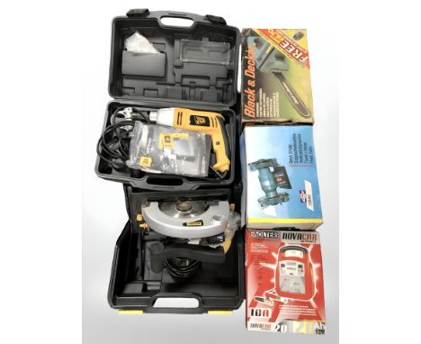 A group of boxed power tools, Black and Decker chain saw, bench grinder, automatic battery charger, circular saw etc 