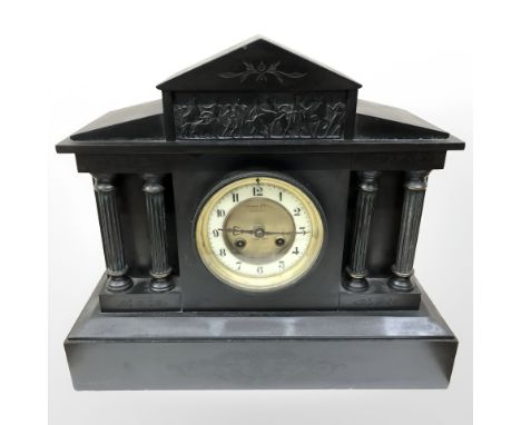 A Victorian black slate mantle clock retailed by Walker & Sons Sunderland, height 33 cm
