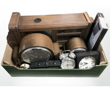 An early 20th century oak wall clock, two mantle clocks, further contemporary clocks, a boxed digital weather station. (1 box