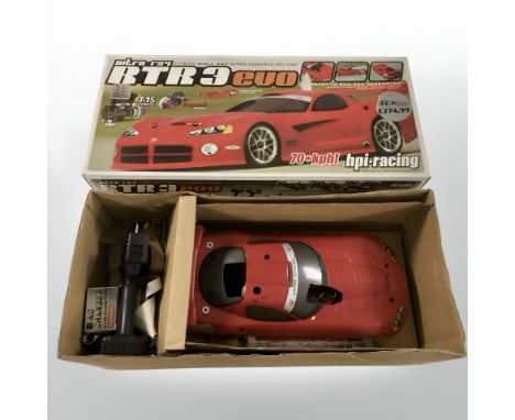 An RTR3 Evo 1:10 scale four wheel drive remote control car, in box.