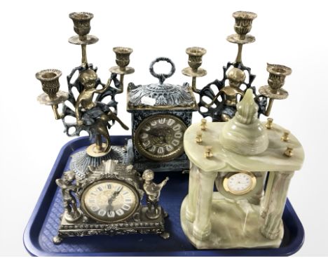 A decorative brass battery operated clock garniture set, a further onyx mantle timepiece and another signed Splendex.