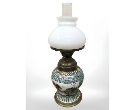 An oriental porcelain vase converted to an oil lamp, height 56 cm.