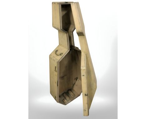 An early 20th century painted wooden cello case with brass bow handles, height 130 cm.