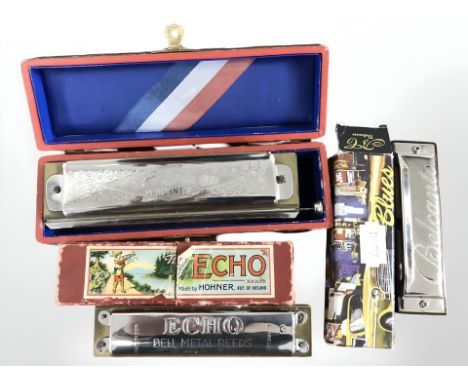 A Hohner Super Chromonica, a further Hohner Echo harmonica and another signed Belcanto, all boxed.