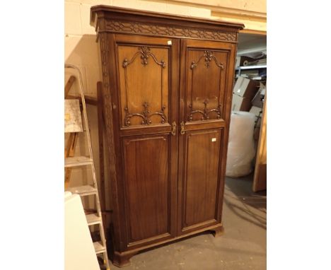 Carved walnut wardrobe with interior walking stick holder H: 190 cm