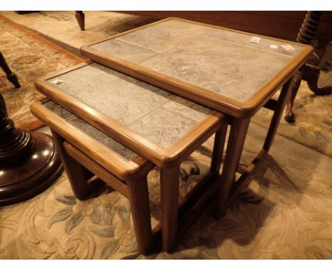 Nest of three tile topped tables possibly Ercol