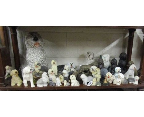 Shelf of dog figures - Mostly Old English sheep dogs to include Royal Doulton