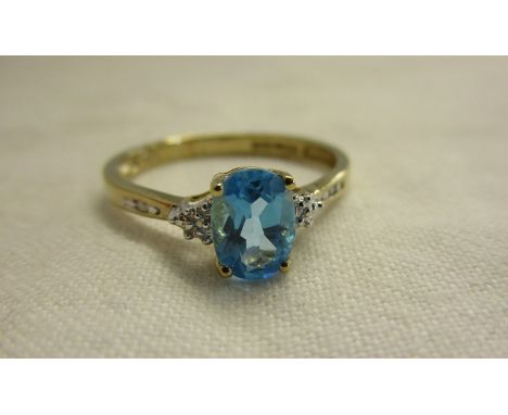 Gold blue topaz &amp; diamond ring