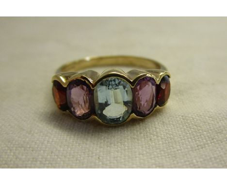 Gold amethyst, garnet &amp; blue topaz ring