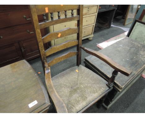 A 19th century design rush seated ladder back carver chair