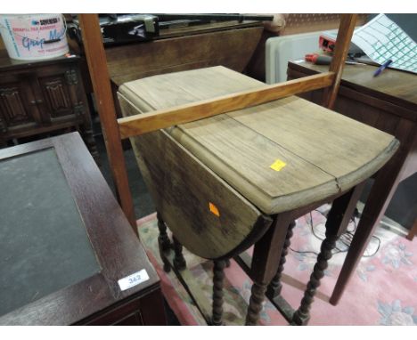 An early to mid 20th Century oak twist gate leg occasional table and a traditional towel rail