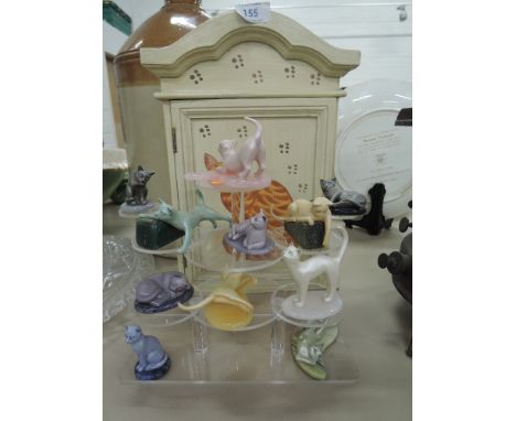 A selection of cats playing on semi precious stones and cat house 