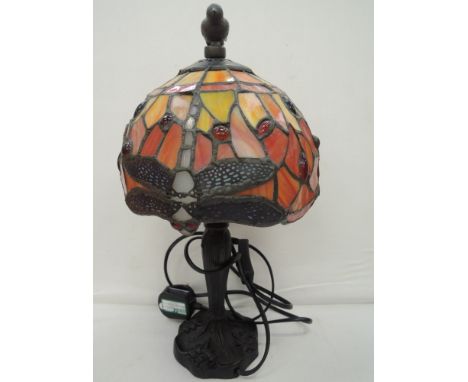A Tiffany style table top lamp with dragonfly decal