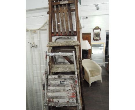 A collection of vintage step ladders