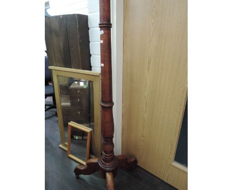 A stained frame standard lamp/pillar having turned column and triple splay legs