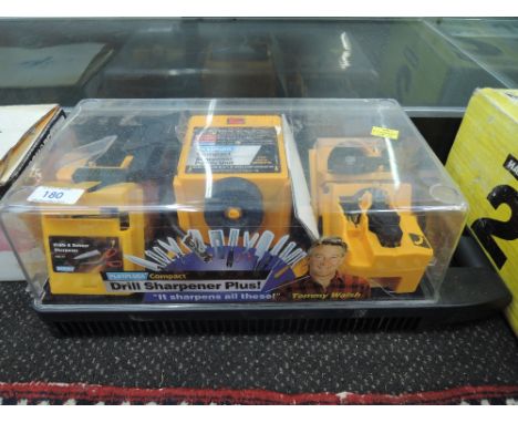 A compact sharpener power unit for grinding and sharpening tools etc as new 
