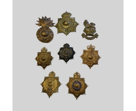 Royal Marine Helmet Plates 1 Brass Kings Crown Helmet Plate, 1 Large Royal Marine Grenade Helmet Plate, 5 Assorted Marine Hel