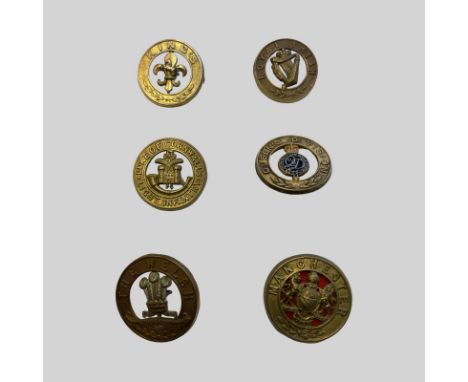 6 Helmet Plate Centres. Lugs in tact. Good Condition. Queens Division (enamel), Kings, Manchester, The Welsh, Royal Irish, Du
